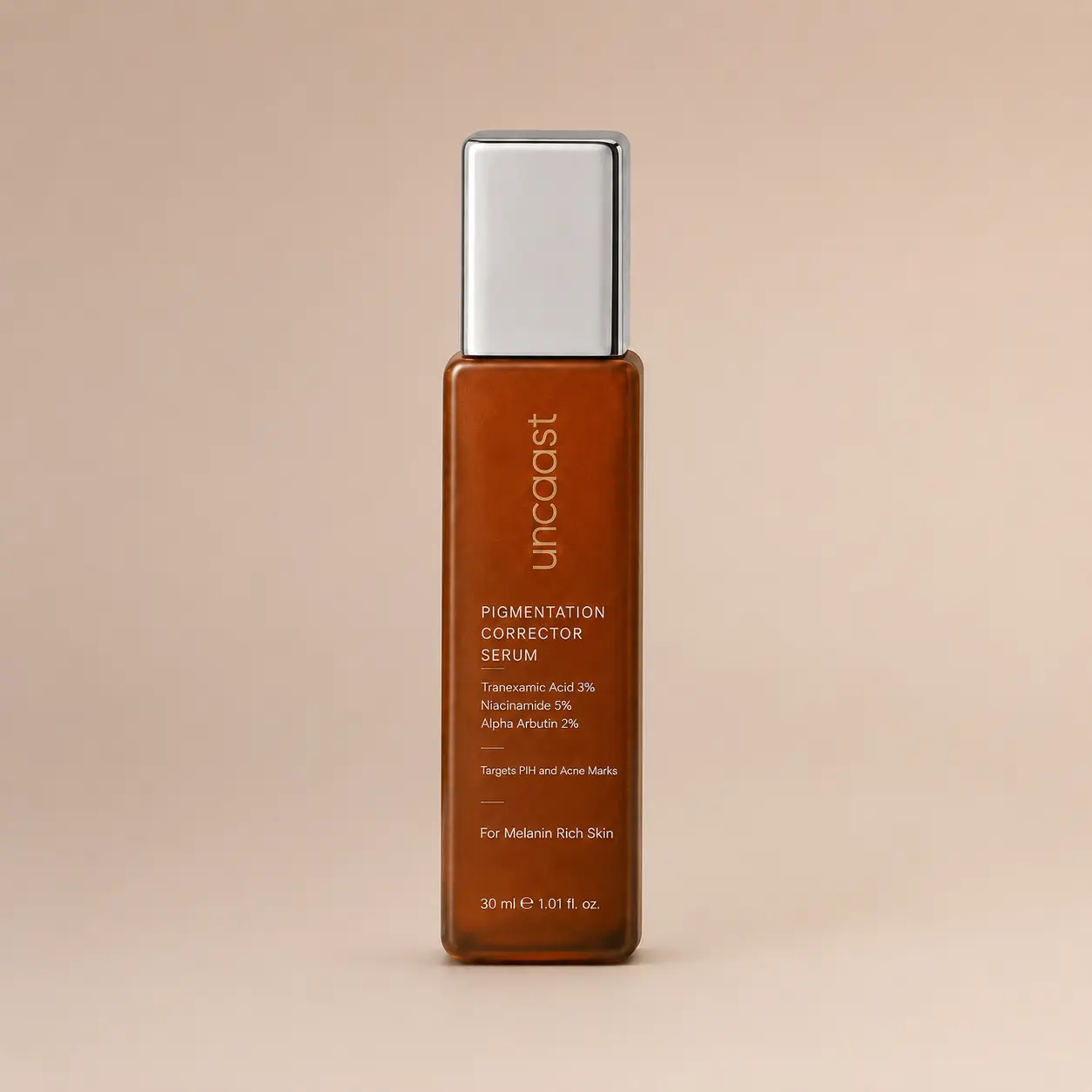 uncaast pigmentation corrector serum bottle on a plain studio background