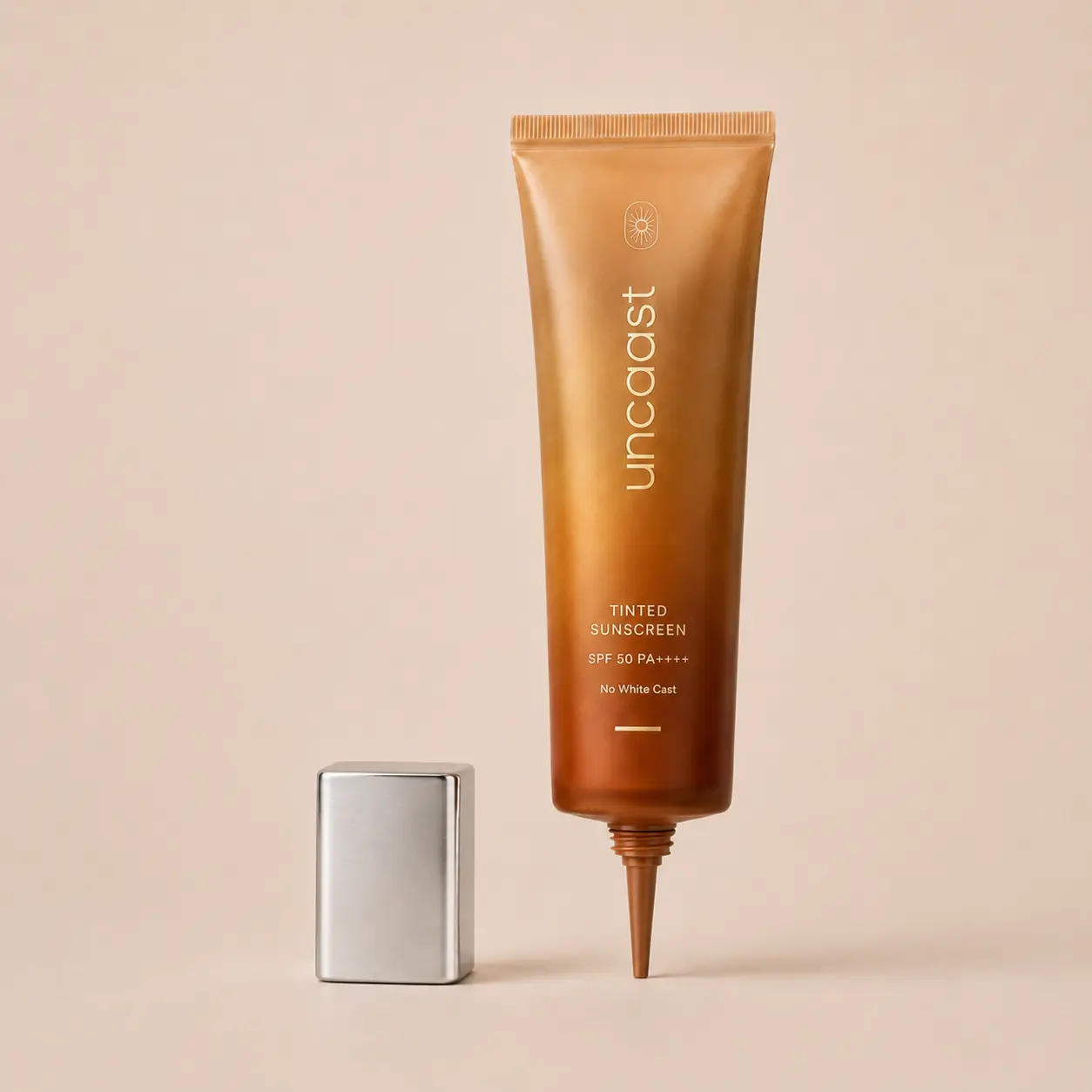 uncaast tinted sunscreen tube with the cap off, shown from above